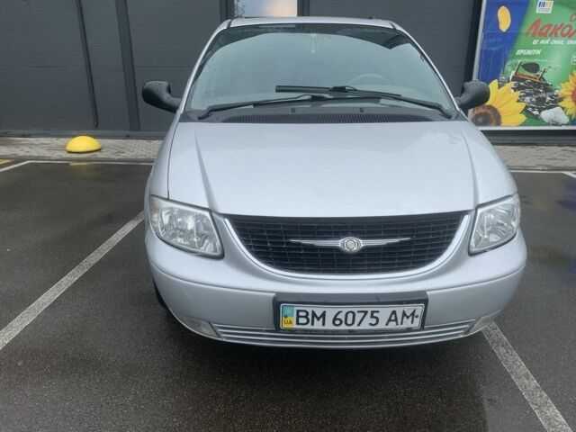 Серый Крайслер Вояджер, объемом двигателя 2.4 л и пробегом 176 тыс. км за 5600 $, фото 1 на Automoto.ua