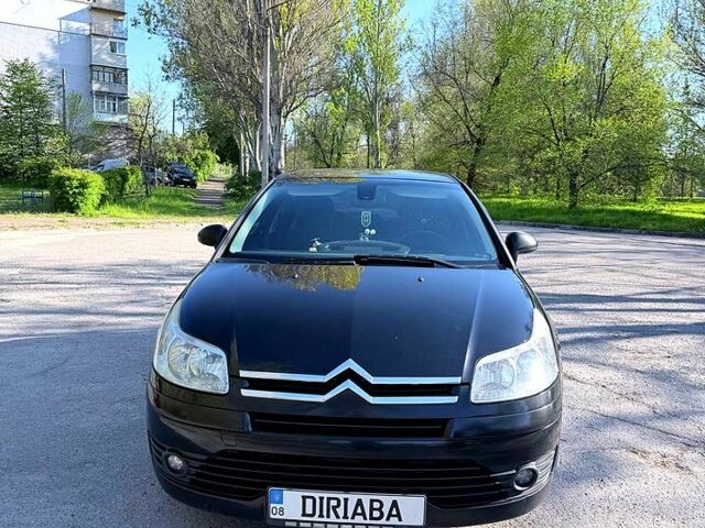 Черный Ситроен С4, объемом двигателя 1.6 л и пробегом 293 тыс. км за 5200 $, фото 1 на Automoto.ua