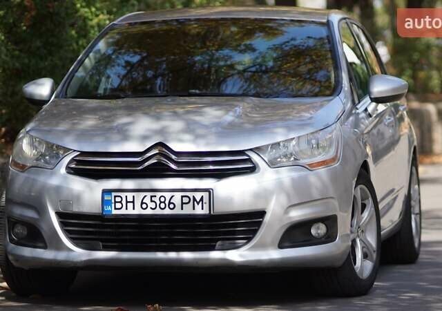 Серый Ситроен С4, объемом двигателя 1.6 л и пробегом 276 тыс. км за 7500 $, фото 1 на Automoto.ua