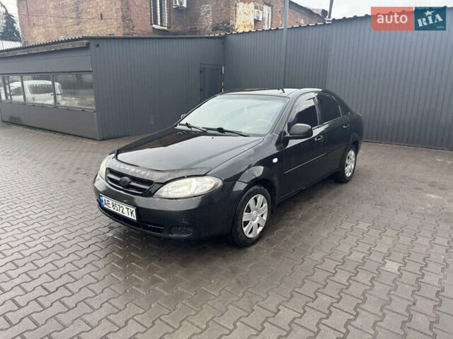 Черный Дэу Джентра, объемом двигателя 1.49 л и пробегом 267 тыс. км за 4400 $, фото 1 на Automoto.ua