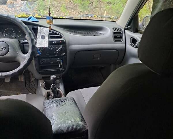 Чорний Деу Ланос, об'ємом двигуна 1.5 л та пробігом 230 тис. км за 2200 $, фото 1 на Automoto.ua