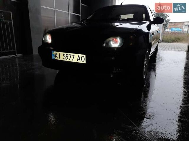 Черный Дэу Ланос, объемом двигателя 1.5 л и пробегом 208 тыс. км за 3000 $, фото 1 на Automoto.ua