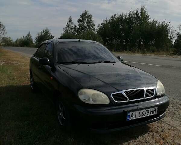 Черный Дэу Ланос, объемом двигателя 1.5 л и пробегом 201 тыс. км за 2600 $, фото 1 на Automoto.ua