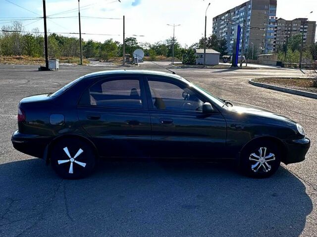 Черный Дэу Ланос, объемом двигателя 1.5 л и пробегом 310 тыс. км за 2500 $, фото 1 на Automoto.ua