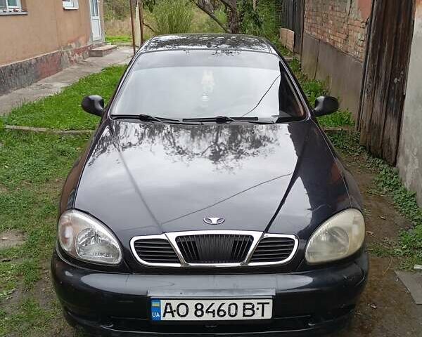 Черный Дэу Ланос, объемом двигателя 1.5 л и пробегом 272 тыс. км за 2000 $, фото 1 на Automoto.ua