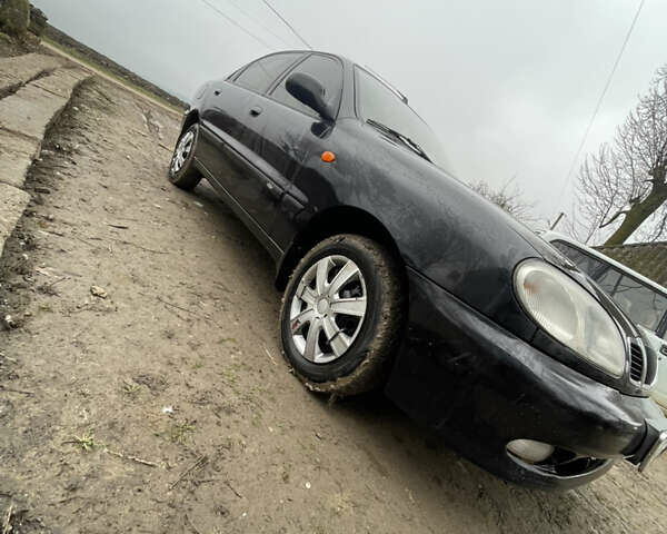 Черный Дэу Ланос, объемом двигателя 1.5 л и пробегом 150 тыс. км за 2000 $, фото 1 на Automoto.ua