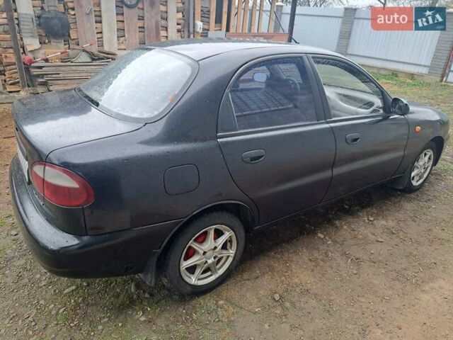 Черный Дэу Ланос, объемом двигателя 1.5 л и пробегом 158 тыс. км за 1250 $, фото 1 на Automoto.ua