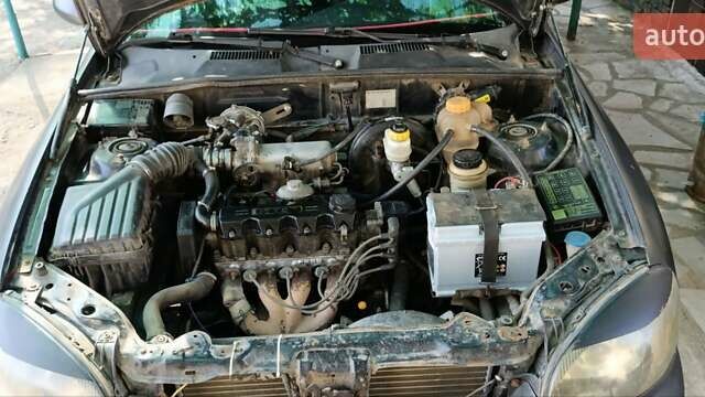 Черный Дэу Ланос, объемом двигателя 1.5 л и пробегом 236 тыс. км за 2300 $, фото 1 на Automoto.ua