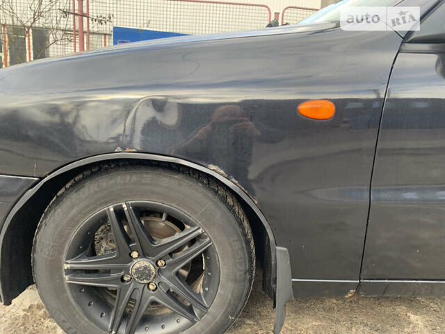 Черный Дэу Ланос, объемом двигателя 1.5 л и пробегом 280 тыс. км за 1300 $, фото 1 на Automoto.ua