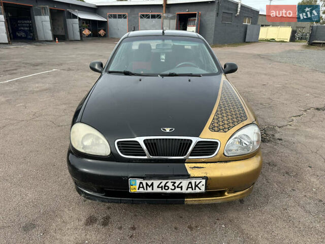 Черный Дэу Ланос, объемом двигателя 1.6 л и пробегом 214 тыс. км за 2350 $, фото 1 на Automoto.ua