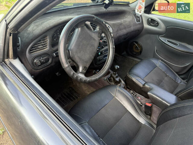 Черный Дэу Ланос, объемом двигателя 1.6 л и пробегом 275 тыс. км за 1700 $, фото 1 на Automoto.ua