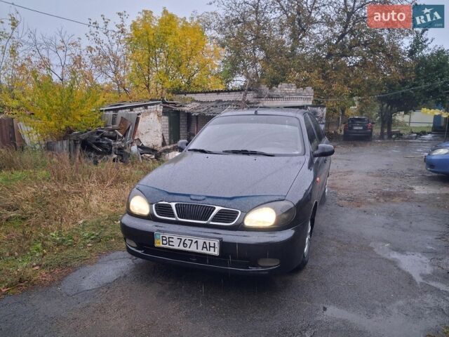 Черный Дэу Ланос, объемом двигателя 1.5 л и пробегом 265 тыс. км за 2000 $, фото 1 на Automoto.ua