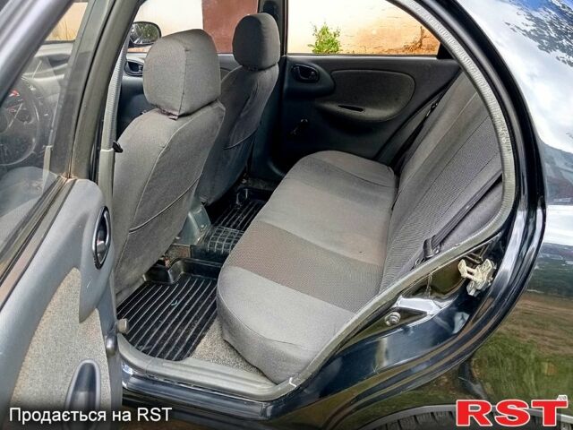 Черный Дэу Ланос, объемом двигателя 1.5 л и пробегом 337 тыс. км за 3000 $, фото 1 на Automoto.ua