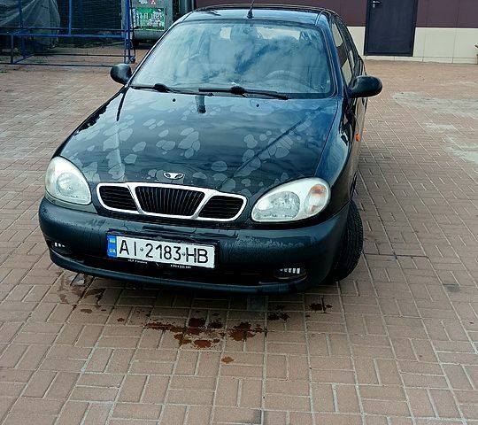 Черный Дэу Ланос, объемом двигателя 1.5 л и пробегом 194 тыс. км за 2000 $, фото 1 на Automoto.ua