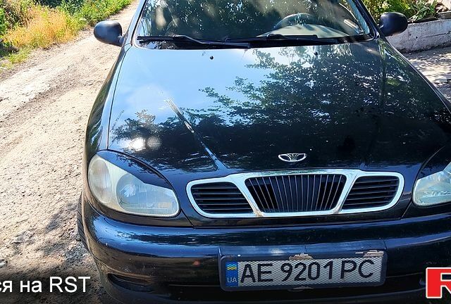 Черный Дэу Ланос, объемом двигателя 1.5 л и пробегом 161 тыс. км за 2100 $, фото 1 на Automoto.ua