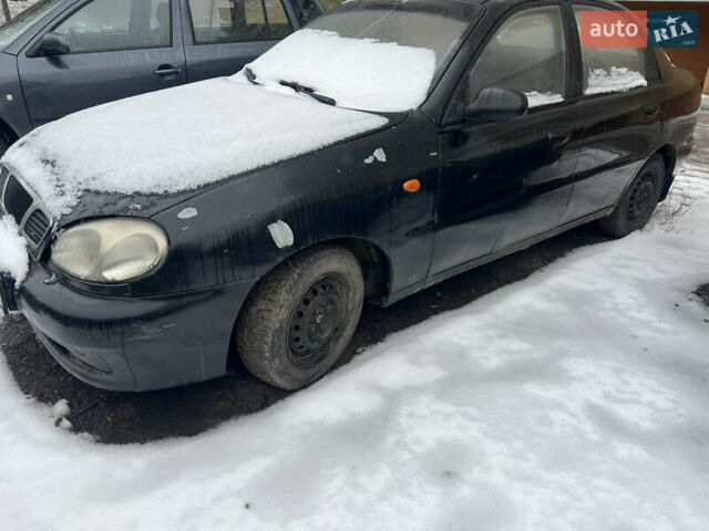 Черный Дэу Ланос, объемом двигателя 1.5 л и пробегом 300 тыс. км за 550 $, фото 1 на Automoto.ua