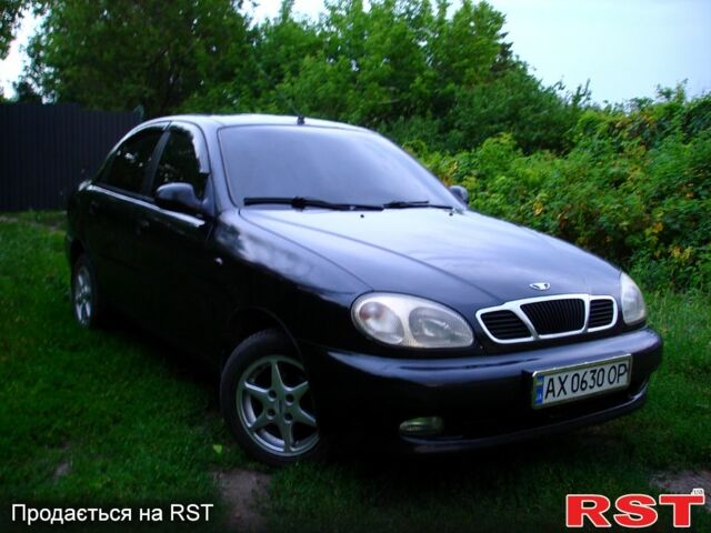 Черный Дэу Ланос, объемом двигателя 1.5 л и пробегом 197 тыс. км за 2550 $, фото 1 на Automoto.ua