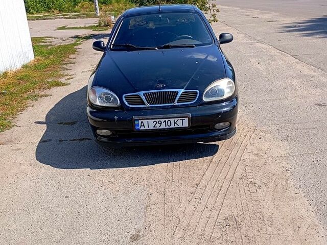 Черный Дэу Ланос, объемом двигателя 1.4 л и пробегом 200 тыс. км за 1600 $, фото 1 на Automoto.ua