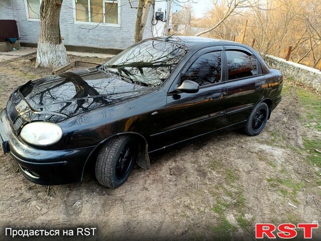 Черный Дэу Ланос, объемом двигателя 1.5 л и пробегом 280 тыс. км за 2100 $, фото 1 на Automoto.ua