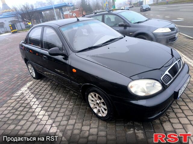 Черный Дэу Ланос, объемом двигателя 1.5 л и пробегом 220 тыс. км за 1000 $, фото 1 на Automoto.ua