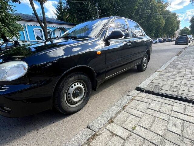 Черный Дэу Ланос, объемом двигателя 1.4 л и пробегом 220 тыс. км за 2400 $, фото 1 на Automoto.ua