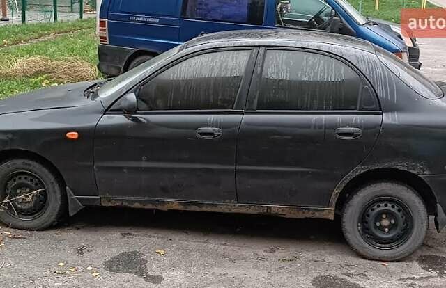 Чорний Деу Ланос, об'ємом двигуна 1.5 л та пробігом 220 тис. км за 800 $, фото 1 на Automoto.ua