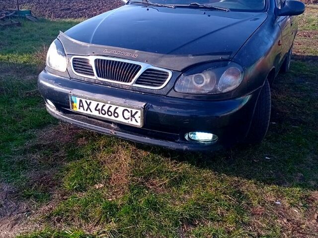 Черный Дэу Ланос, объемом двигателя 1.5 л и пробегом 286 тыс. км за 1000 $, фото 1 на Automoto.ua