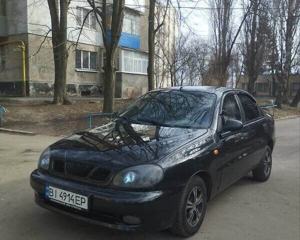 Черный Дэу Ланос, объемом двигателя 1.5 л и пробегом 246 тыс. км за 2650 $, фото 1 на Automoto.ua