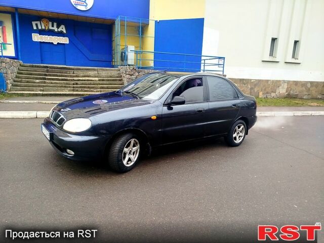 Черный Дэу Ланос, объемом двигателя 1.6 л и пробегом 200 тыс. км за 2100 $, фото 1 на Automoto.ua