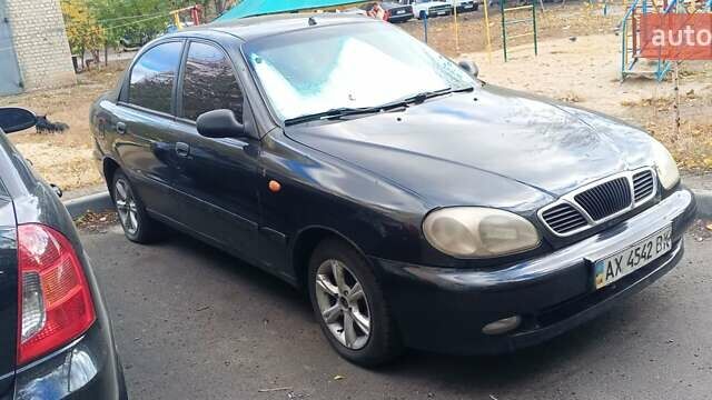 Черный Дэу Ланос, объемом двигателя 1.5 л и пробегом 238 тыс. км за 1950 $, фото 1 на Automoto.ua