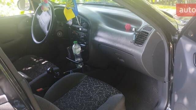 Черный Дэу Ланос, объемом двигателя 1.6 л и пробегом 154 тыс. км за 2800 $, фото 1 на Automoto.ua