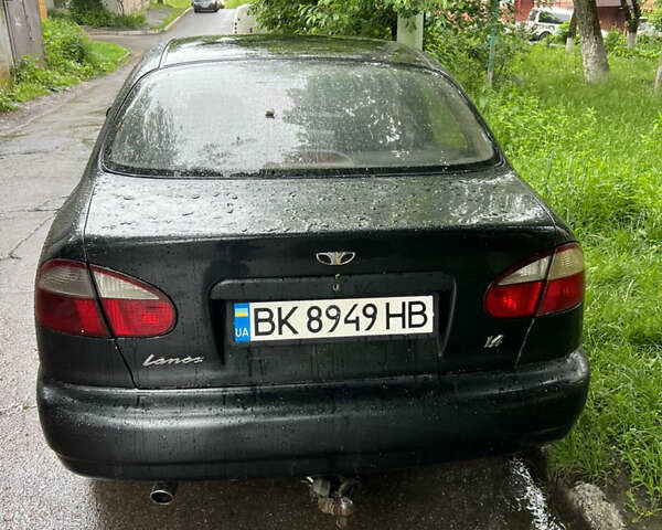 Черный Дэу Ланос, объемом двигателя 1.4 л и пробегом 260 тыс. км за 1200 $, фото 1 на Automoto.ua