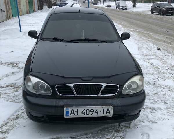 Черный Дэу Ланос, объемом двигателя 1.5 л и пробегом 330 тыс. км за 1500 $, фото 1 на Automoto.ua