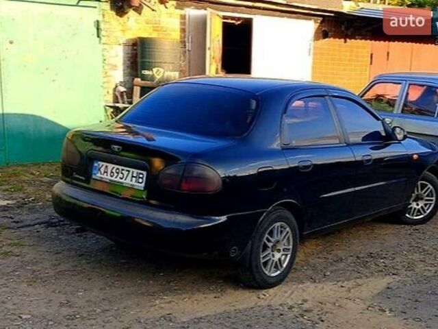 Черный Дэу Ланос, объемом двигателя 1.39 л и пробегом 233 тыс. км за 2200 $, фото 1 на Automoto.ua