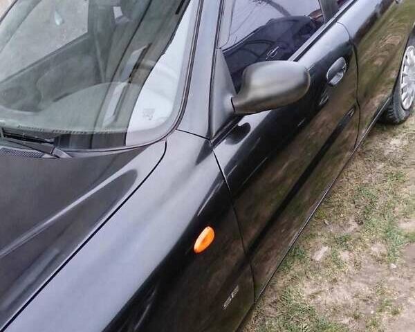 Черный Дэу Ланос, объемом двигателя 1.5 л и пробегом 200 тыс. км за 2300 $, фото 1 на Automoto.ua