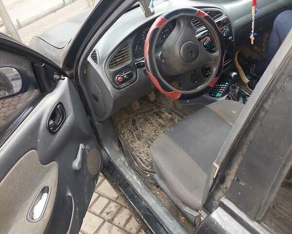 Чорний Деу Ланос, об'ємом двигуна 1.39 л та пробігом 320 тис. км за 1500 $, фото 1 на Automoto.ua