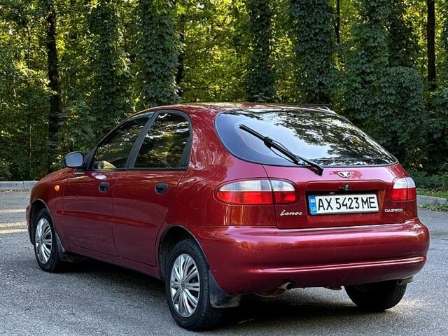 Красный Дэу Ланос, объемом двигателя 1.5 л и пробегом 290 тыс. км за 1950 $, фото 1 на Automoto.ua