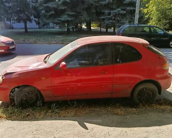 Красный Дэу Ланос, объемом двигателя 1.6 л и пробегом 200 тыс. км за 1000 $, фото 1 на Automoto.ua