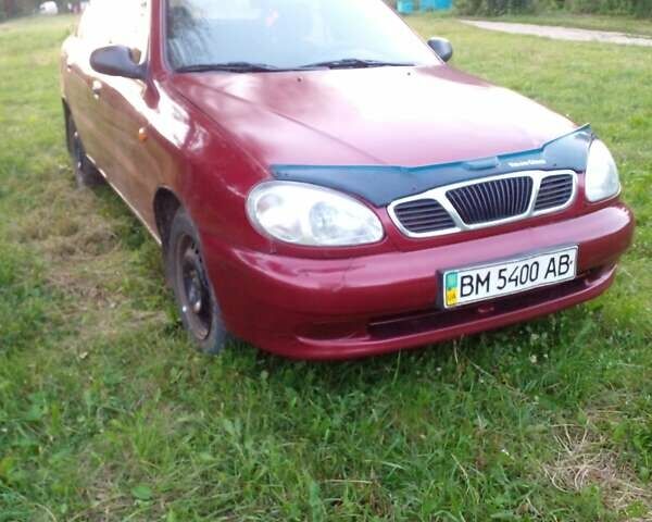 Красный Дэу Ланос, объемом двигателя 1.5 л и пробегом 120 тыс. км за 1100 $, фото 1 на Automoto.ua