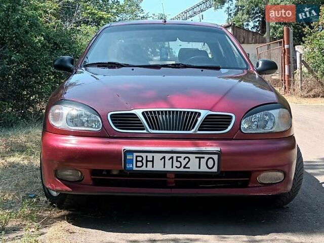 Красный Дэу Ланос, объемом двигателя 1.6 л и пробегом 304 тыс. км за 2900 $, фото 1 на Automoto.ua