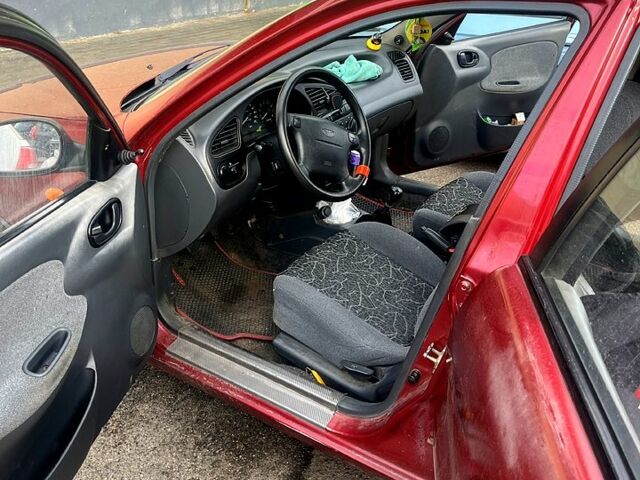 Червоний Деу Ланос, об'ємом двигуна 1.6 л та пробігом 311 тис. км за 2600 $, фото 1 на Automoto.ua