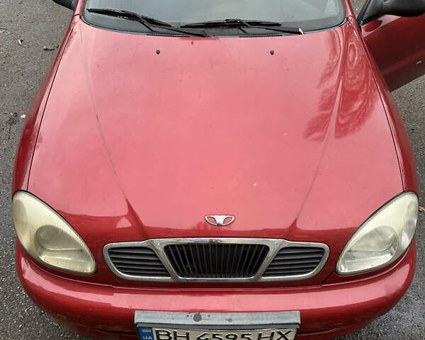 Червоний Деу Ланос, об'ємом двигуна 1.39 л та пробігом 124 тис. км за 2100 $, фото 1 на Automoto.ua