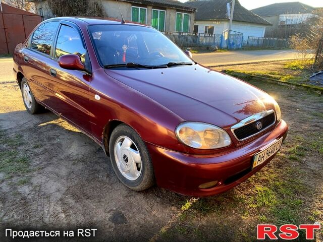 Красный Дэу Ланос, объемом двигателя 1.5 л и пробегом 160 тыс. км за 1500 $, фото 1 на Automoto.ua