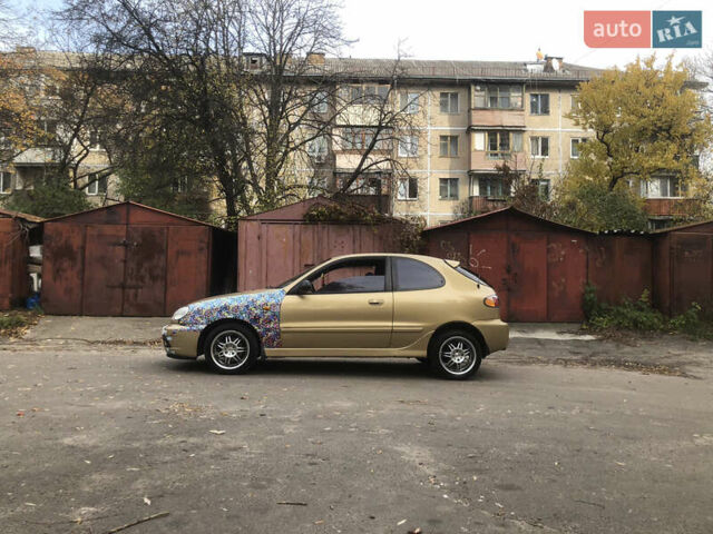 Желтый Дэу Ланос, объемом двигателя 1.6 л и пробегом 215 тыс. км за 2500 $, фото 1 на Automoto.ua