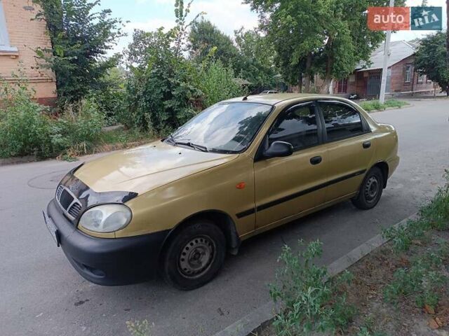 Желтый Дэу Ланос, объемом двигателя 1.5 л и пробегом 244 тыс. км за 1490 $, фото 1 на Automoto.ua