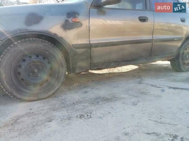 Серый Дэу Ланос, объемом двигателя 1.5 л и пробегом 220 тыс. км за 1021 $, фото 1 на Automoto.ua