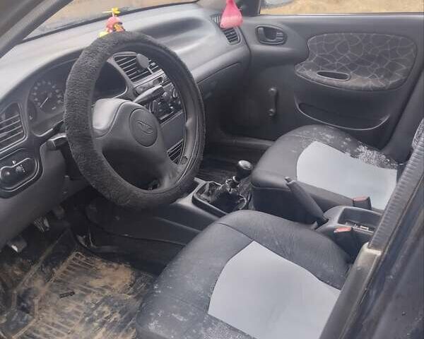 Синий Дэу Ланос, объемом двигателя 1.5 л и пробегом 282 тыс. км за 1500 $, фото 1 на Automoto.ua