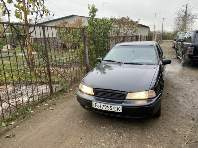 Чорний Деу Нексія, об'ємом двигуна 1.5 л та пробігом 150 тис. км за 1000 $, фото 1 на Automoto.ua