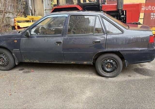 Чорний Деу Нексія, об'ємом двигуна 1.5 л та пробігом 200 тис. км за 1650 $, фото 1 на Automoto.ua