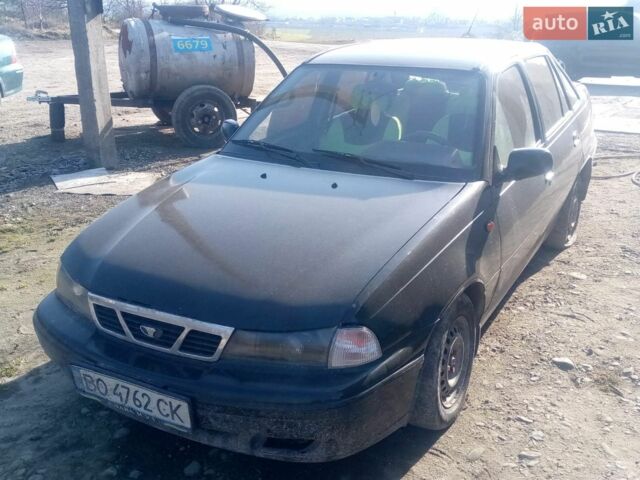 Черный Дэу Нексия, объемом двигателя 1.5 л и пробегом 166 тыс. км за 600 $, фото 1 на Automoto.ua